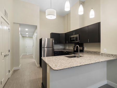 Hallway and Kitchen | Washington Mill 240 | Apartments In Lawrence, MA
