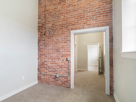 Detail of brick wall and doorway in apartment at Washington Mill 240 in Lawrence, MA.