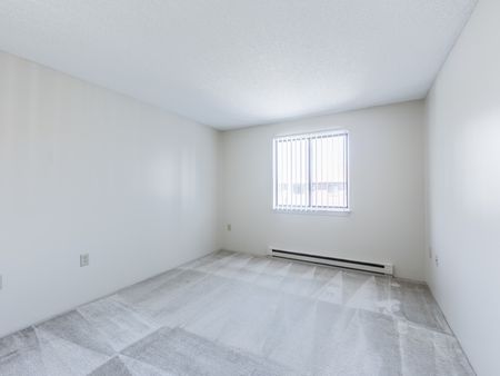 Carpeted bedroom  in apartment at at Westford Park apartments in Lowell, MA.