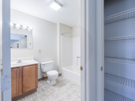 Bathroom and bedroom closet  in apartment at at Westford Park apartments in Lowell, MA.