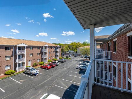 Balconies and parking at Westford Park apartments in Lowell, MA.