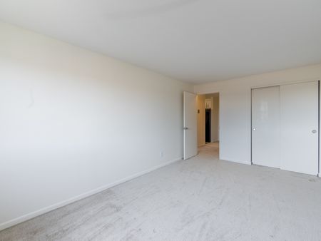 Living Room - showing empty room and entrances  in apartment at Pheasant Run  | Nashua NH Apartments