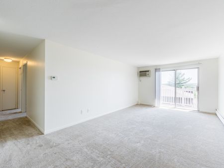 Open Floor Plan with sliding doors to balcony  in apartment at Pheasant Run  | Nashua NH Apartments