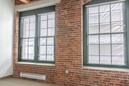 Large windows with blinds allow for plenty of natural light |  381 Congress Lofts | Apartments in Downtown Boston