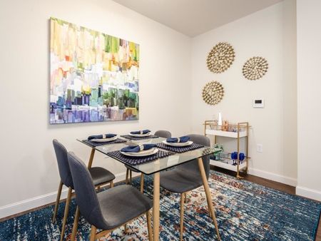 Dining area with modern art on the wall | Apartments For Rent Chelmsford MA | Mill & 3 Apartments