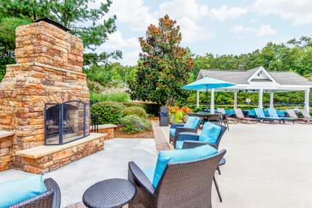 View of Pool Area, Showing Fireplace, Outdoor Furniture, and Cabana at Summer Park Apartments