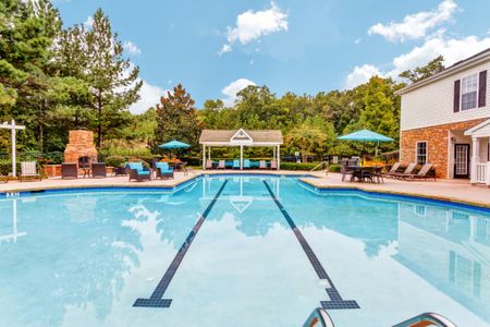 View of Pool Area, Showing Fenced-In Area, Cabana, and Picnic Areas at Summer Park Apartments