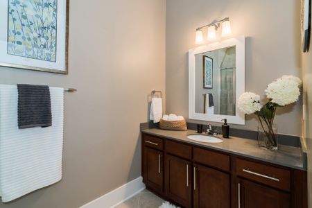 View of Bathroom, Showing Single Vanity, Toilet, and Décor at Alpha Mill Apartments