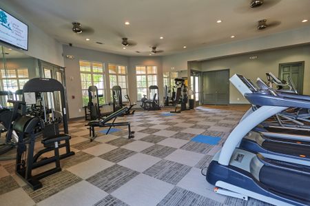 View of Fitness Center, Showing Cardio Equipment, Free Weights, and Weight Benches at Cottonwood Reserve Apartments