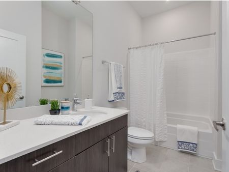 View of Bathroom, Showing Single Vanity, Toilet, and Tub at The Melrose Apartments