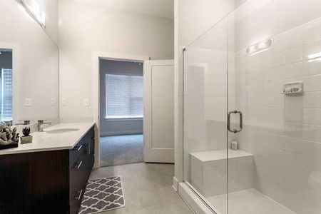 View of Bathroom, Showing Plank Wood Flooring and Walk-In Shower at The Melrose Apartments
