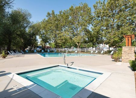 View of Jacuzzi, Showing Pool,  Loungers, Trees, and Fenced-In Area at Fox Point in Old Farm Apartments