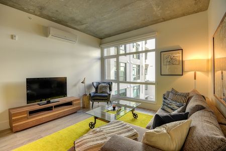 Image of spacious apartment living area with natural light