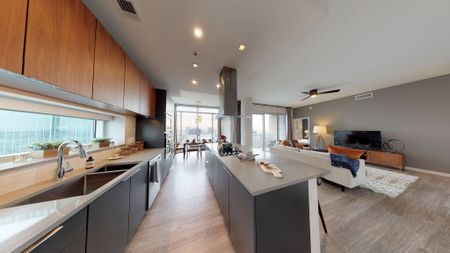 Brightly lit open concept kitchen and living space