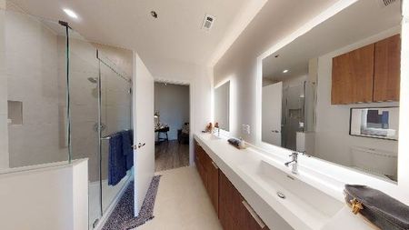 Spa-like retreat with glass enclosed shower and dual vanity