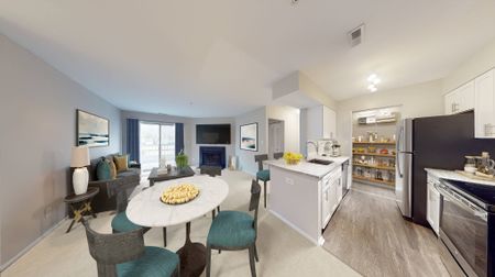 Cozy two-bedroom home with fireplace and upgraded design Countertops and White Cabinetry at Alister Town Center Columbia apartments.