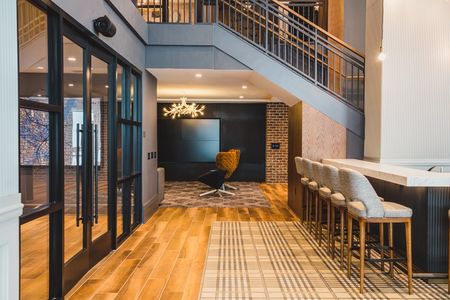 Clubhouse coffee bar and stairway - Boutique Feel with Modern Design at Modera Old Ivy apartments in Atlanta