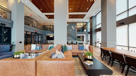 Image of clubroom space featuring plenty of seating at Modera Old Ivy apartments in Atlanta