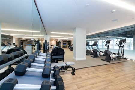 Modera Lake Merritt apartment homes in Oakland club quality fitness center with weights rack