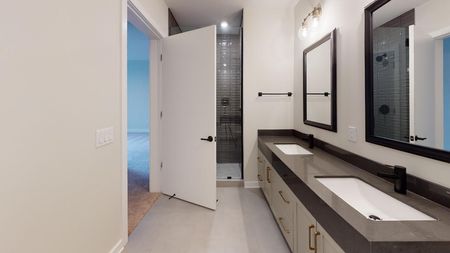double vanity spa-like bathroom with shower at Modera Old Ivy in Atlanta Georgia