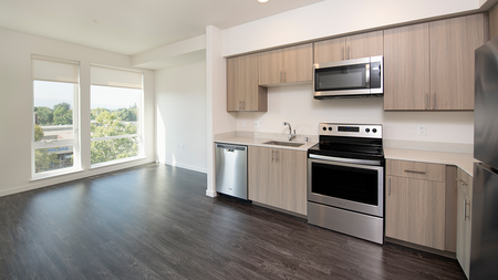 Open concept kitchen with stainless steel appliances