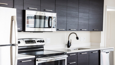 Kitchen with stainless steel appliances in an apartment at Modera Mosaic.