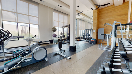 Fitness center with cardio and free weights at Modera Mosaic apartments  in Fairfax.