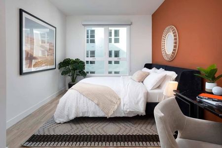 Large window in colorful bedroom at Modera San Diego