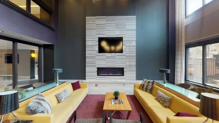 Resident lounge with ample seating and fireplace