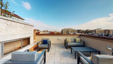 Rooftop terrace social seating near fireplace