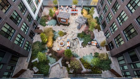 Aerial View of our Outdoor Social Lounges and Firepit at Modera Mosaic apartments in Fairfax, VA.