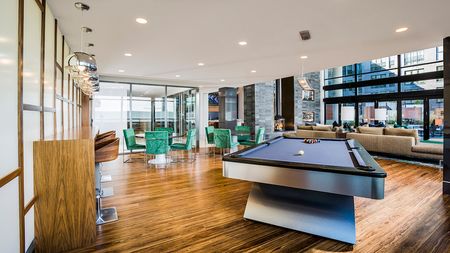 Game Room featuring Billiards and Seating for Work or Play at Modera Mosaic apartments in Fairfax.
