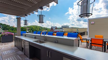 Rooftop mini bar with ample seating for entertaining