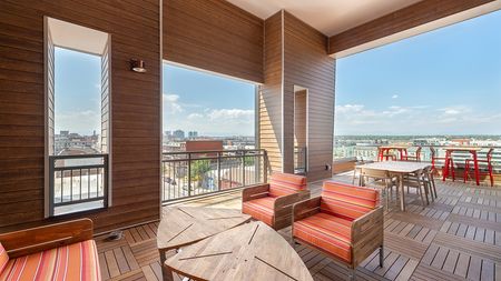 Rooftop deck with plush seating areas, great views, and outdoor TV