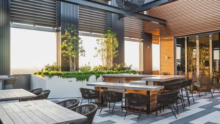 Exterior Courtyard at Sunset with Large Doors that Roll Up and Ample Seating