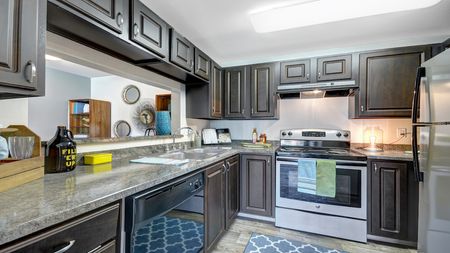 Redesigned Kitchen featuring granite counter-tops and stainless steel appliances
