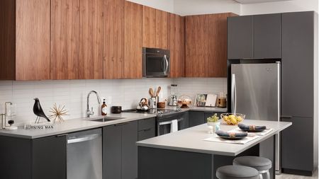 Open concept kitchen with stainless steel appliance package