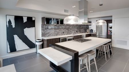 Demonstration kitchen with gas cook top in resident lounge