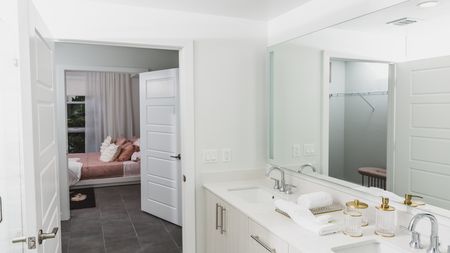 Large bedroom and bathroom with pass through and double vanities