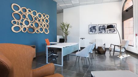 Chic Leasing Office with Concrete Flooring with Large Decorative Windows