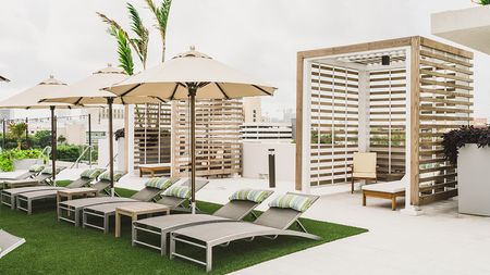 Cabanas and chaise lounges on outdoor terrace