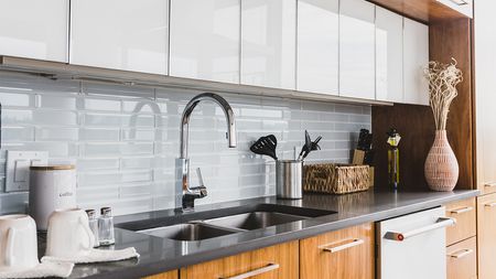 Two tone white and brown cabinets in Arris apartment kitchen