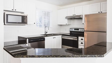Well appointed and brightly lit open concept kitchen