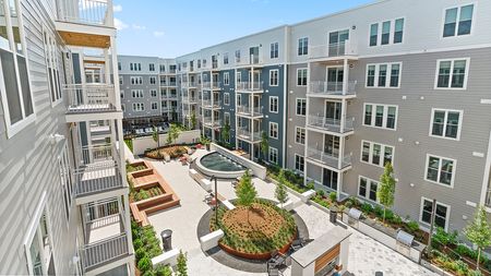 Expansive outdoor courtyard spaces at Modera Framingham apartments.