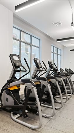 Cardio equipment and weight stations at Modera Framingham apartments.