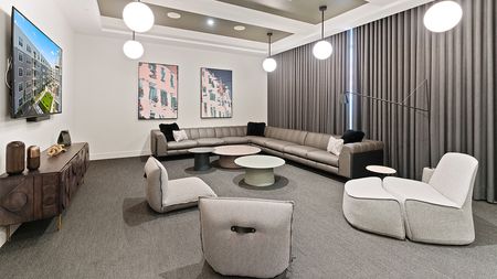 Lounge area with HDTV at Modera Framingham apartments.