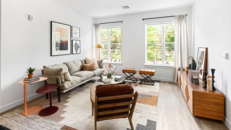 Light-filled homes with sleek furniture and expansive views at Modera Framingham apartments.
