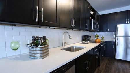 Sleek Subway Tile Backsplash and Quartz Counter in Modern Kitchen