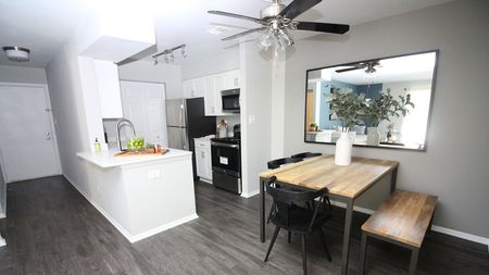 Spacious Dining Room next to Open Concept Kitchen in an Alister Town Center apartment.