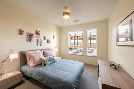 spacious bedroom with plenty of natural light at modera river north apartments in denver colorado